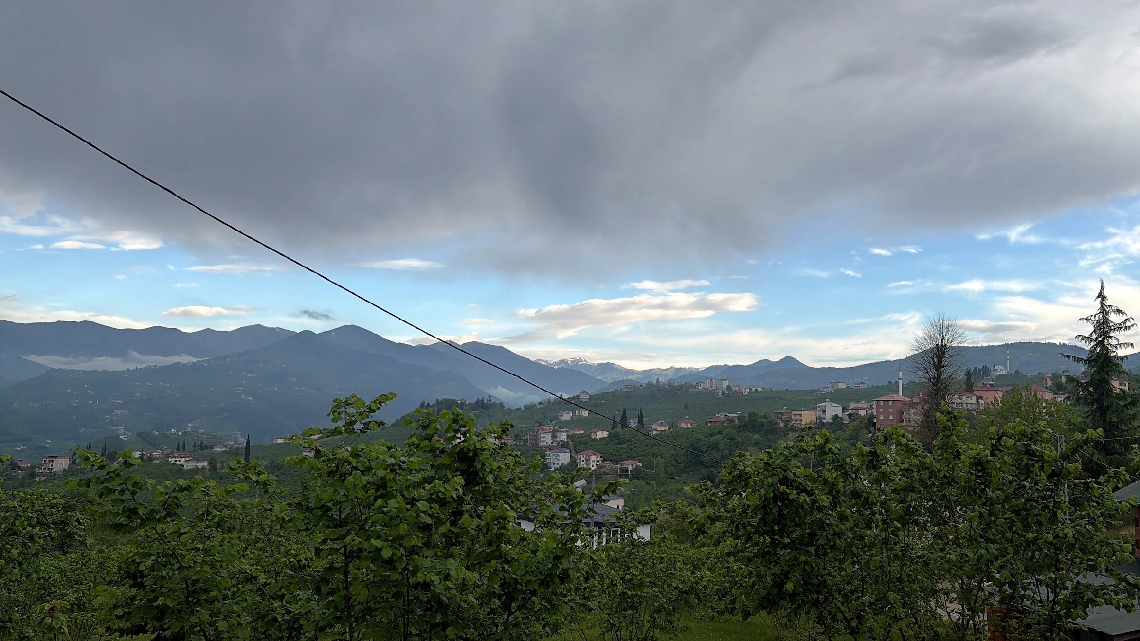 Mountain view under clouds