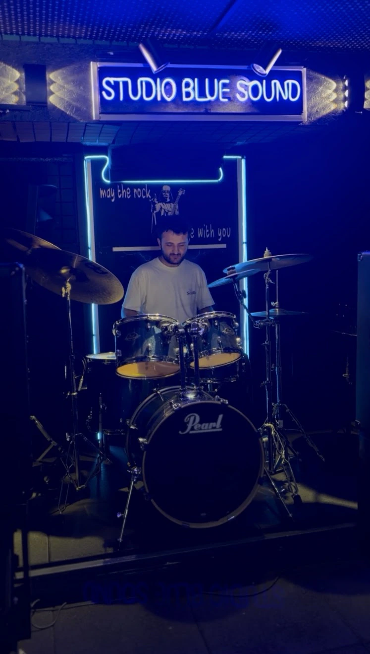 Playing drums in a studio